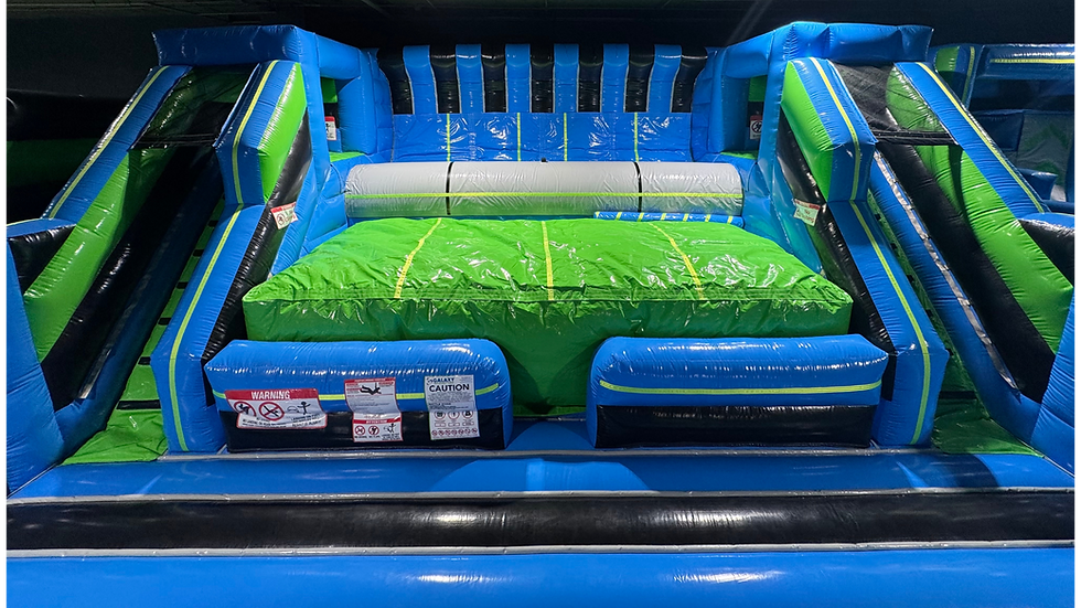 Large open inflatable jumping pad surrounded by soft barriers for safe bouncing.